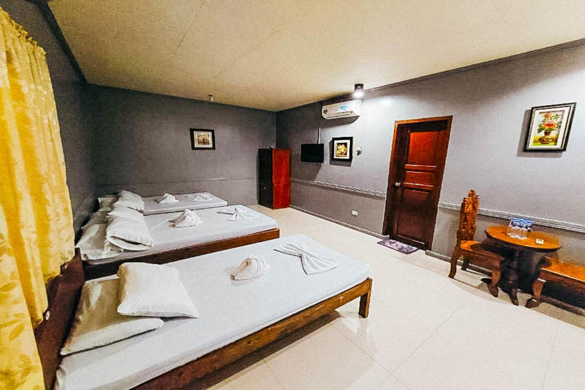 Mbg Travellers Inn Powered By Cocotel Puerto Princesa Δωμάτιο φωτογραφία