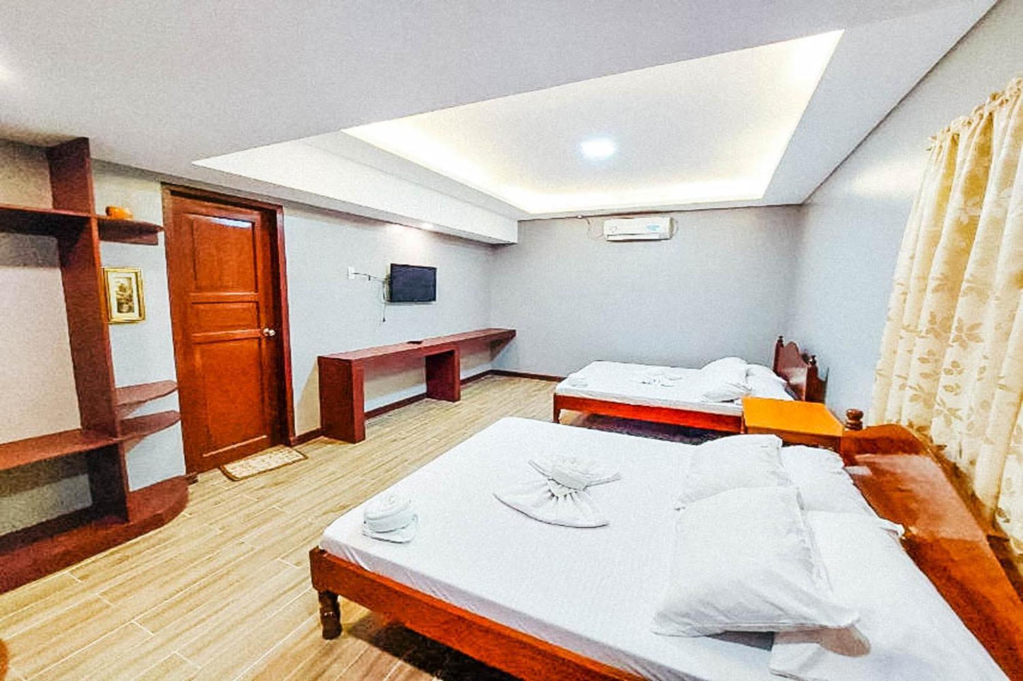 Mbg Travellers Inn Powered By Cocotel Puerto Princesa Δωμάτιο φωτογραφία